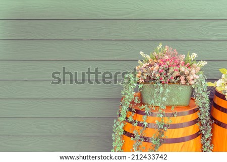 old wooden barrel with beautiful flowers, Vintage style