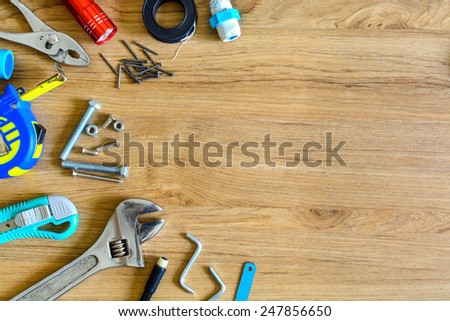 Set of manual tools on wooden background