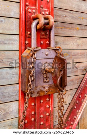 Old wooden and metal with rusty key and chain