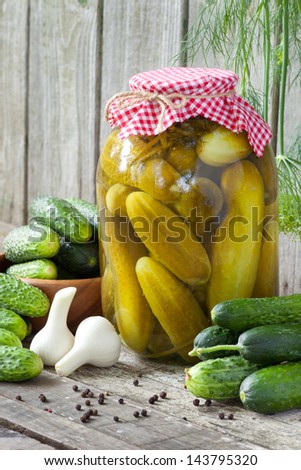 fresh and pickled cucumbers, homemade preserved vegetables