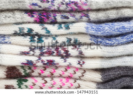 Pile of wool clothing, winter background