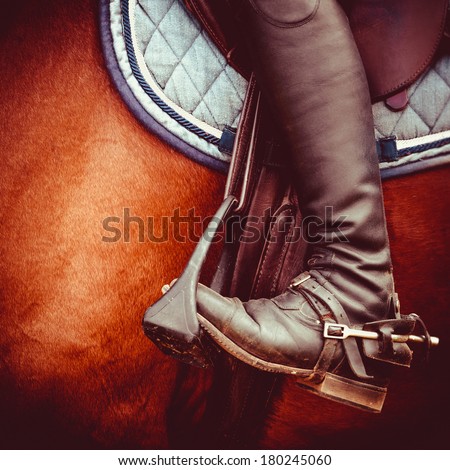 vintage stylized photo of jockey riding boot, horses saddle and stirrup