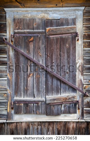 closed rustic window of old wooden house