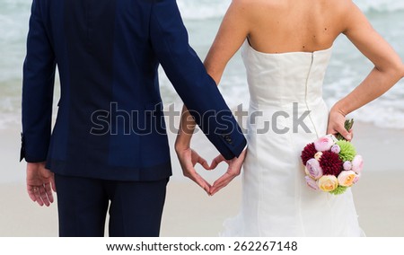 bride and groom hands holding,wedding bouquet