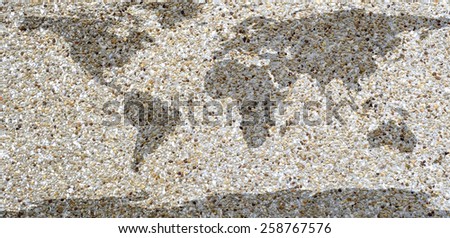 world map on sand wall background