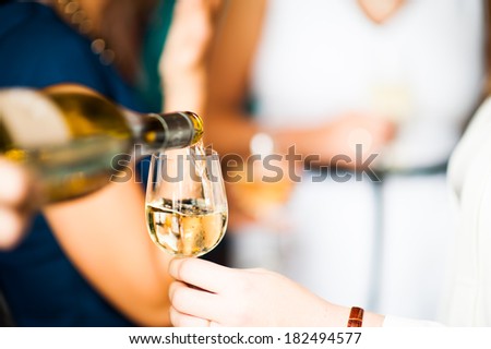Pouring a glass white wine