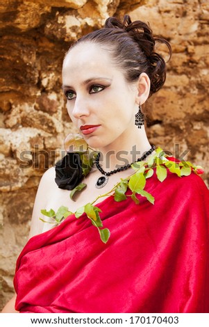 Woman with rose to fling  one\'s  arms  around  so.\'s  neck