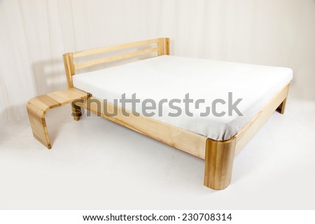 wooden bed - piece of furniture in front of white background