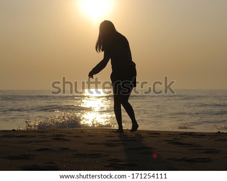 girl walk on beach ( Silhouette )