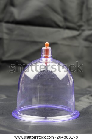 Traditional arabic medical cupping therapy equipment known as Bekam Hijama on dark background