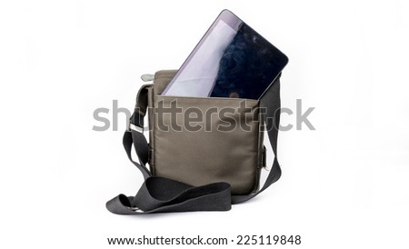 A small dark green sling bag containing modern tablet device in the compartment. Isolated on white background.