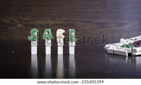 Common business terms - Slightly defocused and close-up of SAFE word on clothes peg stick with lots of clothes peg at background