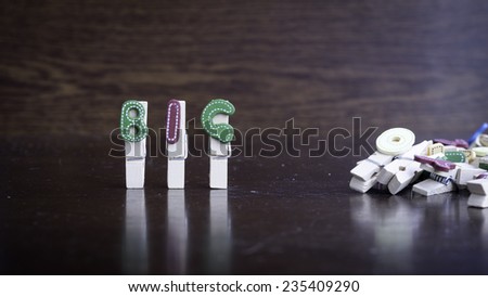 Common business terms - Slightly defocused and close-up of STEADY word on clothes peg stick with lots of clothes peg at background