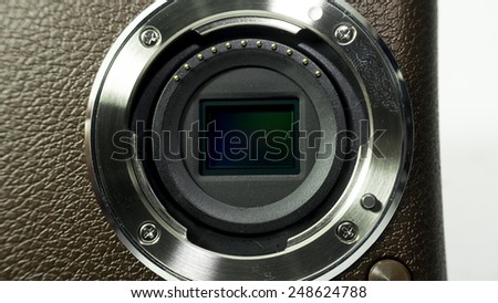 Closeup shot of camera sensor (CCD or Cmos) for compact, APS-C, SLR or DSLR point and shoot camera. Isolated on white background. Copy space.