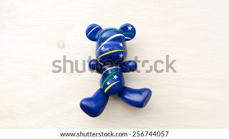 Kuala Lumpur, Malaysia - March 01 ,2015: Blue color Bearbrick plastic toy. Bearbrick is a collectible toy designed by MediCom Toy Incorporated, derived from the cartoon-style representation of a bear