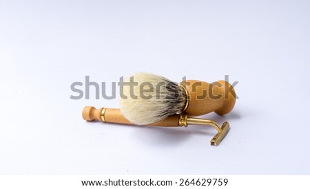 Wooden razor holder and shaving brush set. Shot using natural light. Slightly defocused and close-up shot. Copy space.