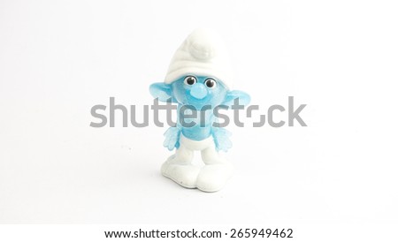 Kuala Lumpur, Malaysia - April 02, 2015: Cute Smurf toy figure on plain background. The Smurfs is a Belgian comic and tv franchise centered on a fictional colony of small blue creatures in the forest