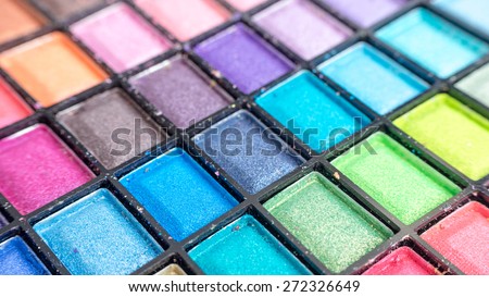 Colourful eye shadow tool and brush make up set. Slightly defocused and close-up shot. Concept of colour palette. Copy space.