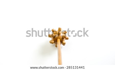 Traditional manual wooden therapeutic massage stick with round shape and blunt pointed edges. Isolated on white background. Copy space.