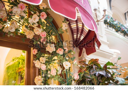 Restaurant entrance canopy in Paris with roses