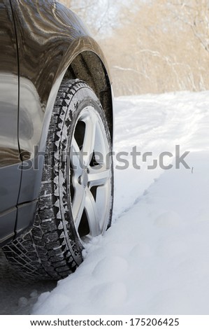 car driving in forest with much snow