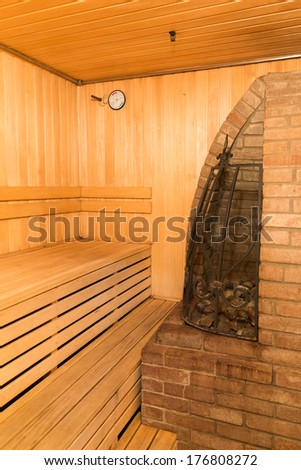 interior of a sauna with big stone oven