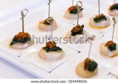Small portions of of scallops in a buffet