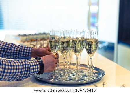Glasses of sparkling champagne on a buffet table