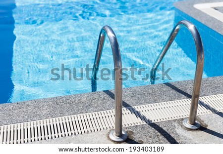 Metal ladder leading into the swimming pool