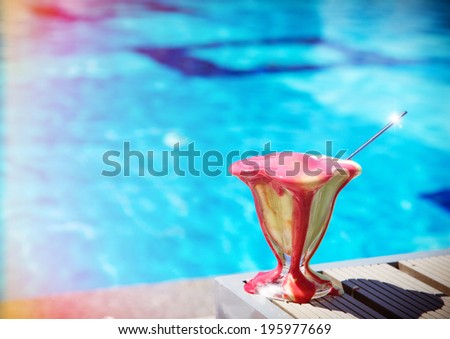 Melting ice cream on a table near pool