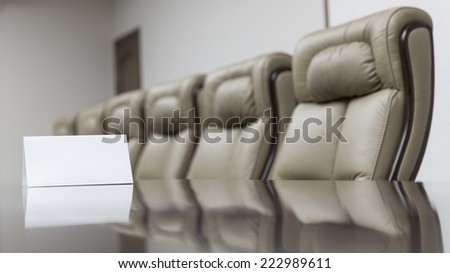 Meeting room with empty card on table