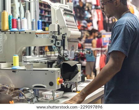 MIAMI, USA - AUGUST 29, 2014 : Cap on embroidery machine in a store on August 29, 2014 in Miami.