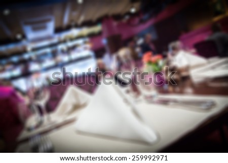 Fine table setting in a luxurious restaurant, Blurred background