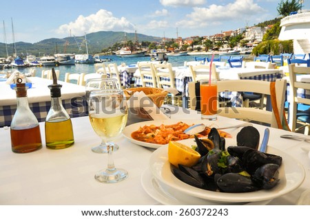 Seafood dinner in a Greece restaurant, Mediterranean sea resort