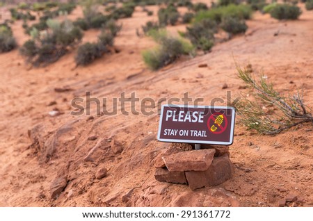 Please stay on trail Sign Warning that Hikers should stay on The Trail for Their Protection
