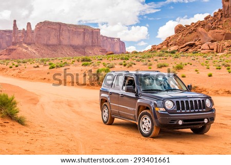 MONUMENT VALLEY, UTAH, USA - MAY 25, 2015 - Offroading through the Monument Valley in Jeep Patriot. Jeep Patriot  is sport utility vehicle (SUV), manufactured by American automaker Chrysler.