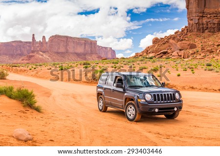 MONUMENT VALLEY, UTAH, USA - MAY 25, 2015 - Offroading through the Monument Valley in a Jeep Patriot. Jeep Patriot  is sport utility vehicle (SUV), manufactured by American automaker Chrysler.