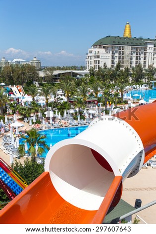 ANTALYA, TURKEY - MAY 11, 2014:  Colorful water park tubes and a swimming pool in Delphin Imperial hotel on MAY 11, 2014 in Antalya.