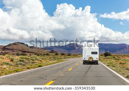 Camper trailer on Highway in USA, road trip in motorhome