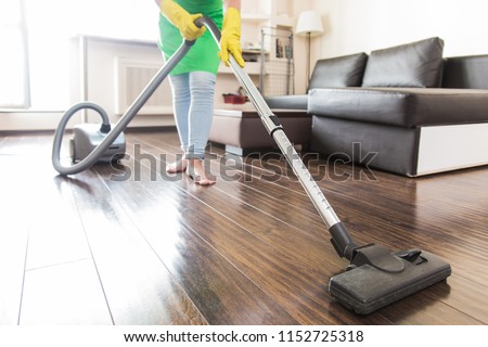 cleaning service. dust removal with vacuum cleaner. clean floor at home