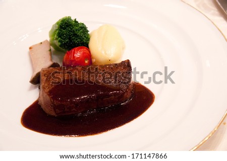Close up delicate steak on a white plate in the wedding reception (Japan).