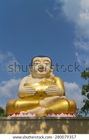 monk statue for katyayana sitting with sky background
