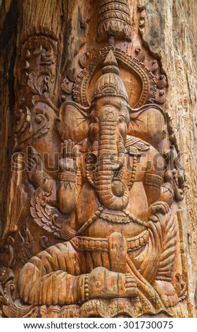 wood carving for Hindu god Ganesha on the wood pole