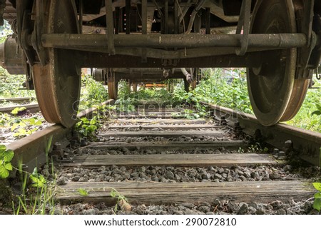 under an old railroad wagon