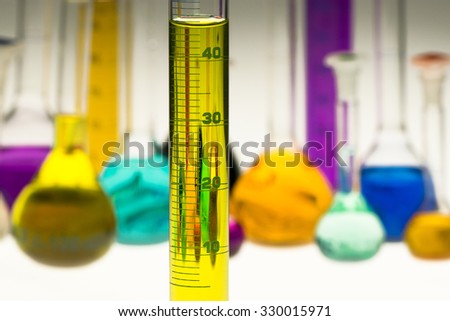 measuring cylinder with chemical flasks