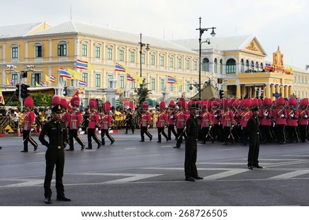 Bangkok, Thailand - 2 December 2014: Soldiers perform the marching of the colors military parade, showcasing Thailand\'s strength to celebrate the 87th birthday of His Majesty King Bhumibol Adulyadej