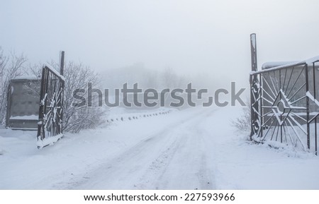 Gate in the snowy darkness