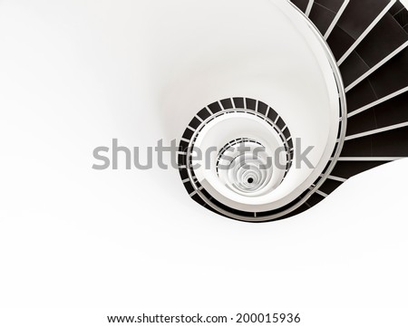 White and black spiral stairs going far down
