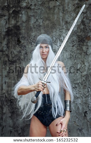 Girl with long white hair in chain mail and sword