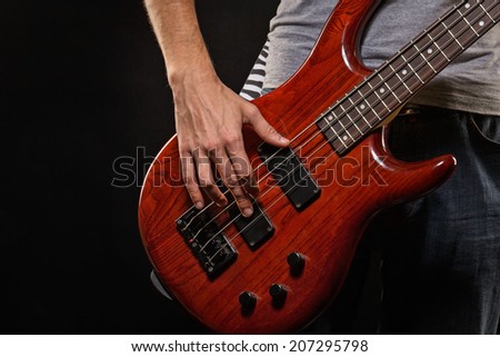 Guitarist playing blues photographed close-up hands and guitar, man is not recognizable